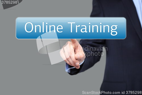 Image of technology, internet and networking concept - businessman pressing online training button on virtual screens