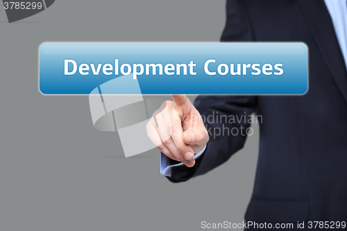 Image of technology and internet  concept - businessman pressing development courses button on virtual screens