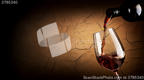 Image of Pouring wine in cellar