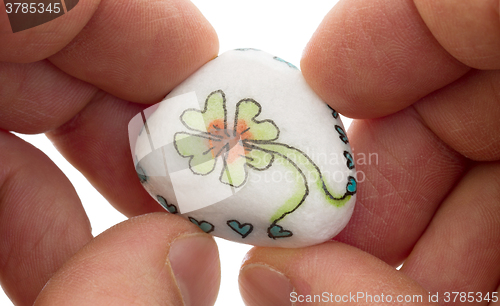 Image of Stone with drawing of a clover four and small hearts