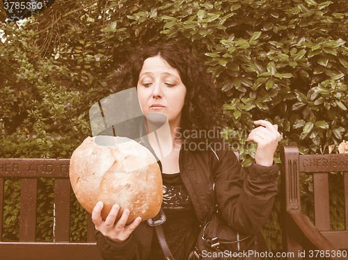 Image of Girl eating bread vintage