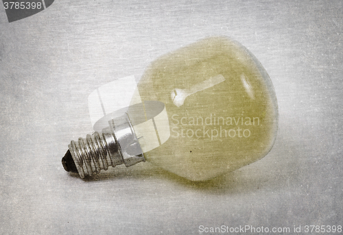 Image of Old yellow lightbulb isolated on a white background