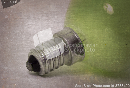 Image of Old green lightbulb isolated on a white background