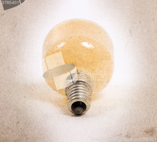 Image of Old orange lightbulb isolated on a white background