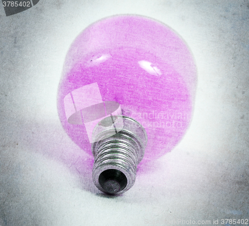 Image of Old pink lightbulb isolated on a white background