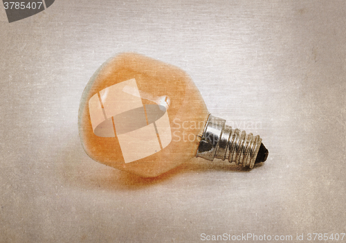 Image of Old orange lightbulb isolated on a white background