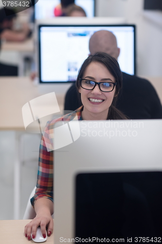 Image of startup business, woman  working on desktop computer