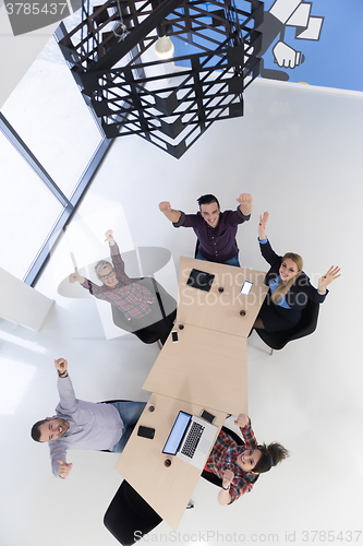 Image of aerial view of business people group on meeting