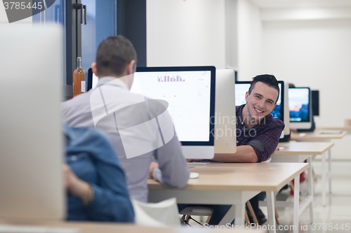 Image of startup business, software developer working on desktop computer