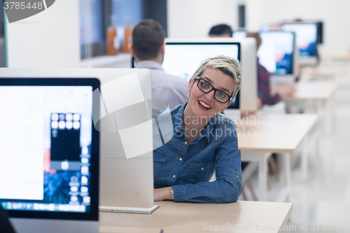 Image of startup business, woman  working on desktop computer