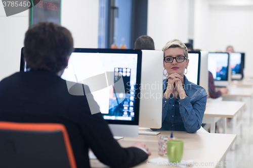 Image of startup business, woman  working on desktop computer