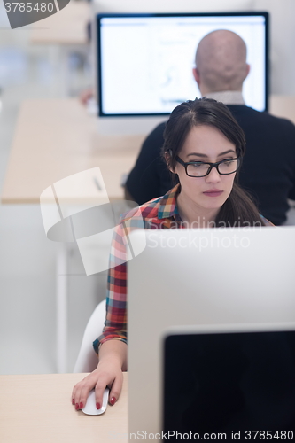 Image of startup business, woman  working on desktop computer