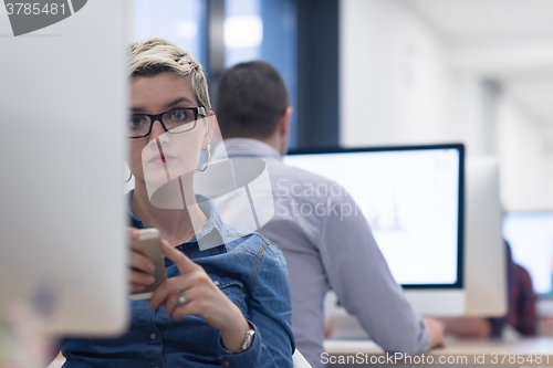 Image of startup business, woman  working on desktop computer