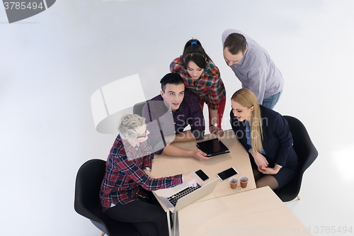Image of aerial view of business people group on meeting