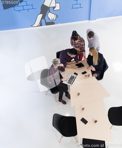 Image of aerial view of business people group on meeting