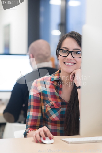 Image of startup business, woman  working on desktop computer