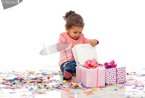 Image of happy little baby girl with birthday presents