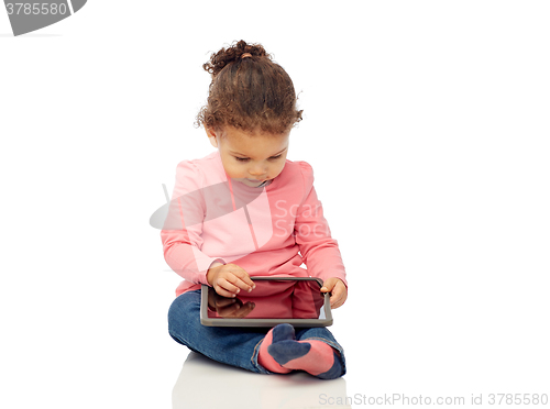 Image of little baby girl playing with tablet pc computer