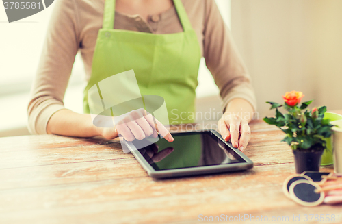 Image of close up of woman or gardener with tablet pc