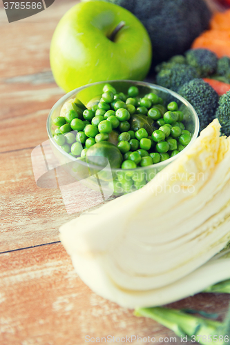 Image of close up of ripe vegetables on wooden table