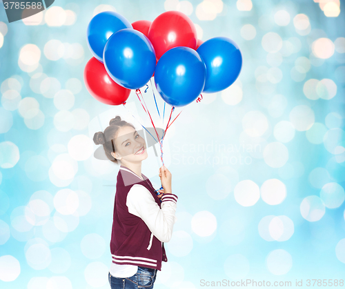 Image of happy teenage girl with helium balloons