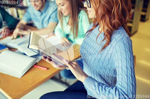 Image of close up of students reading books at school