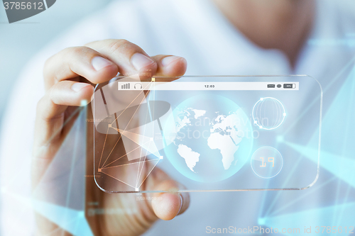 Image of close up of hand with earth globe on smartphone