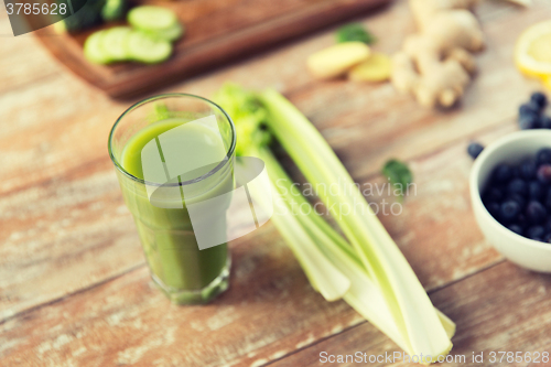 Image of close up of fresh green juice glass and celery