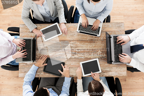 Image of business team with laptop and tablet pc