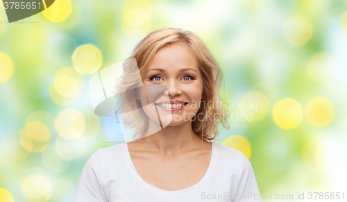 Image of smiling woman in blank white t-shirt