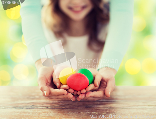 Image of close up of happy family holding easter eggs