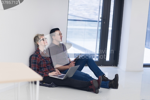 Image of startup business, couple working on laptop computer at office
