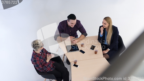 Image of aerial view of business people group on meeting