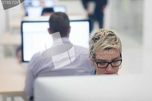 Image of startup business, woman  working on desktop computer