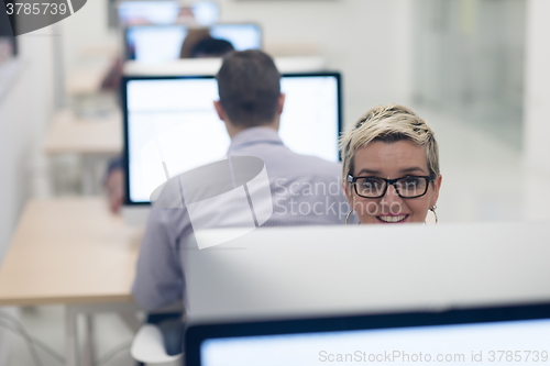 Image of startup business, woman  working on desktop computer