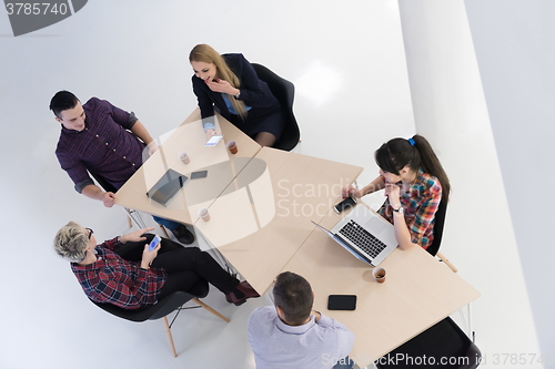 Image of aerial view of business people group on meeting