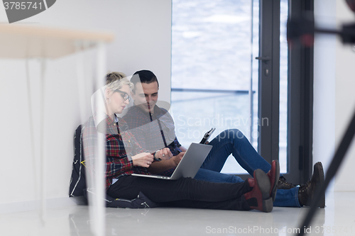 Image of startup business, couple working on laptop computer at office