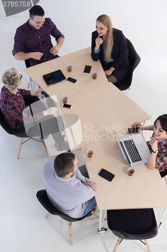 Image of aerial view of business people group on meeting