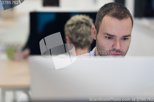 Image of startup business, software developer working on desktop computer