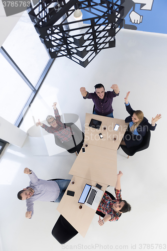 Image of aerial view of business people group on meeting