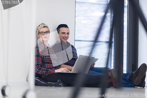 Image of startup business, couple working on laptop computer at office