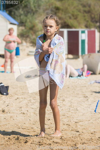 Image of Frozen Wet Girl basking on the beach cover with a towel