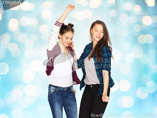 Image of happy smiling pretty teenage girls dancing