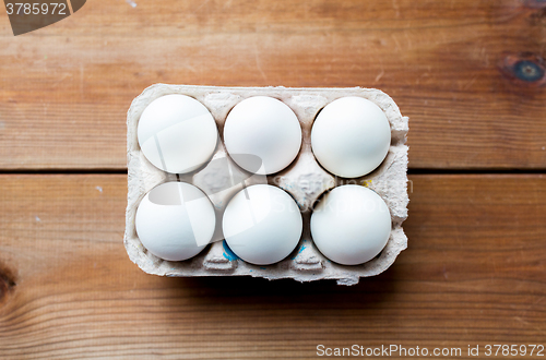 Image of close up of white eggs in egg box or carton