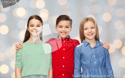 Image of happy boy and girls hugging