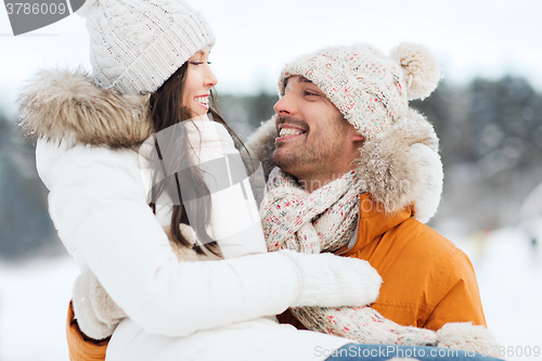 Image of happy couple outdoors in winter