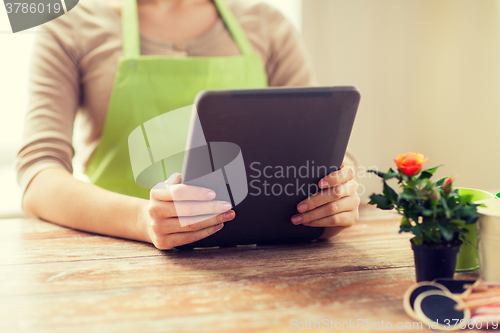 Image of close up of woman or gardener holding tablet pc