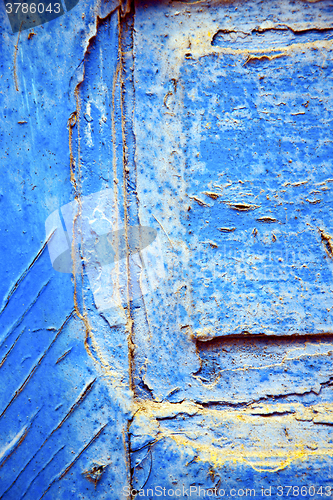 Image of dirty stripped paint in the blue gold