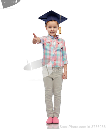 Image of happy girl in bachelor hat showing thumbs up