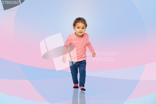 Image of beautiful little baby girl walking